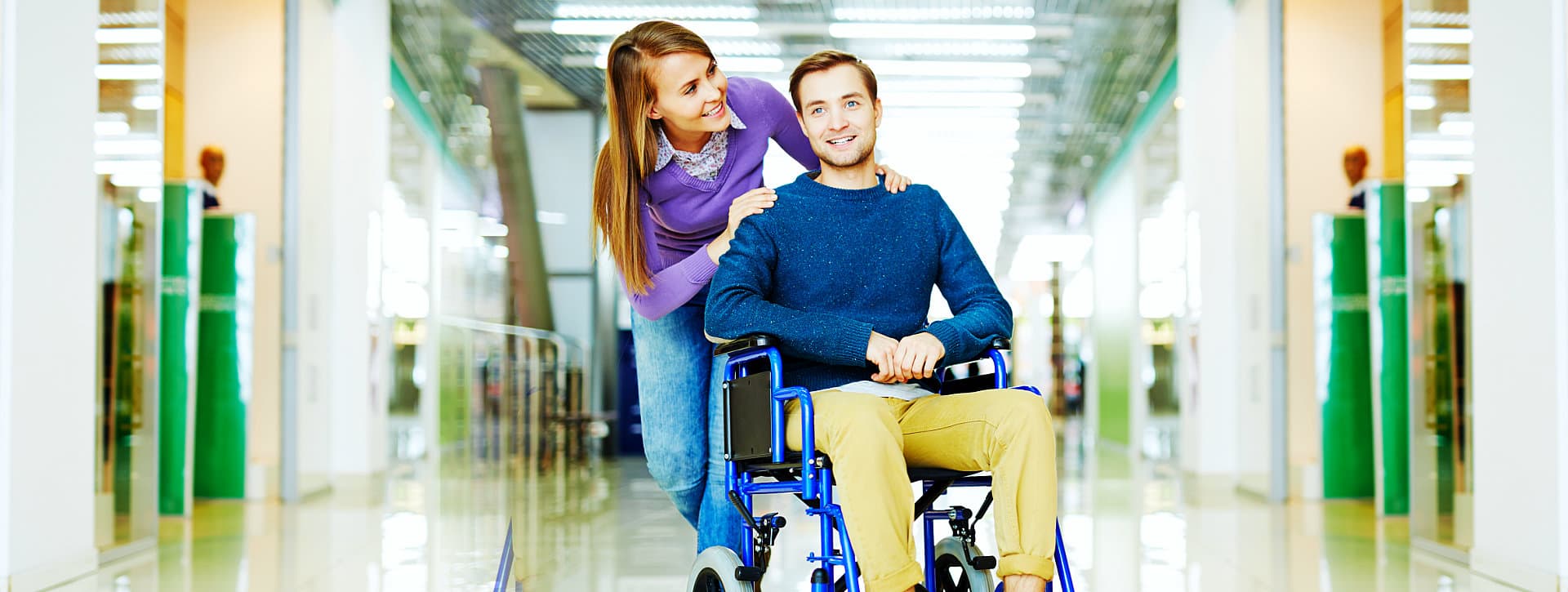 portrait of a woman and a man in a wheelchair
